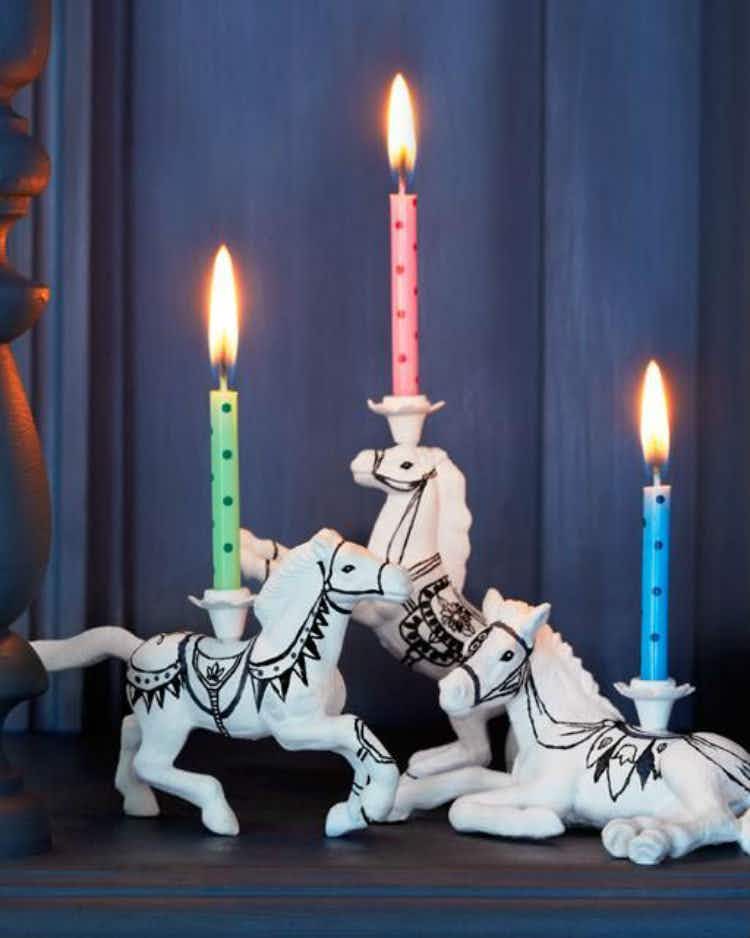 Design birthday candle holders using toy animals.