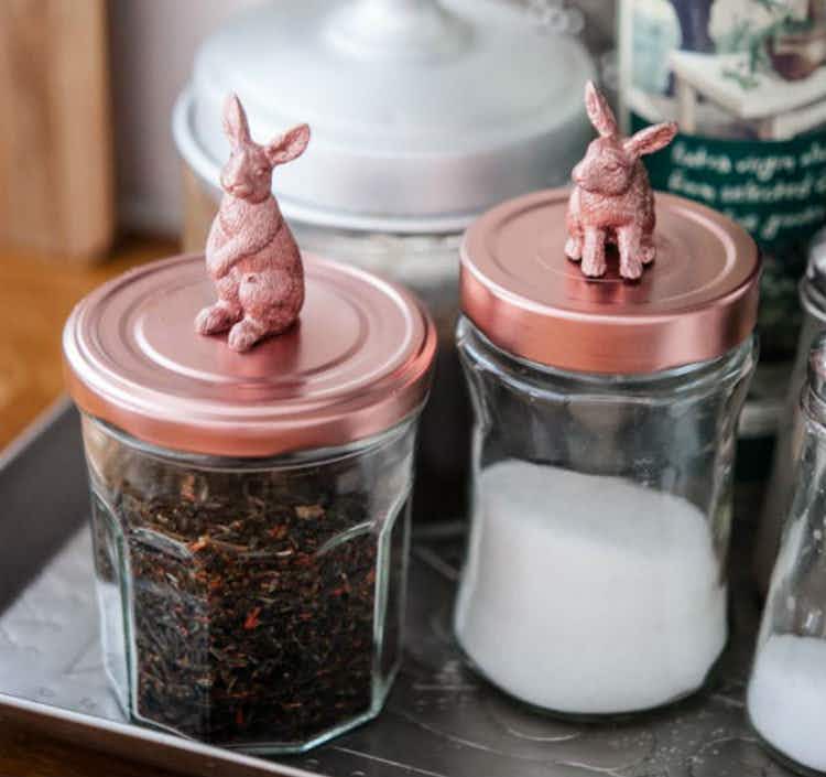  Attach small toys on top of jars.