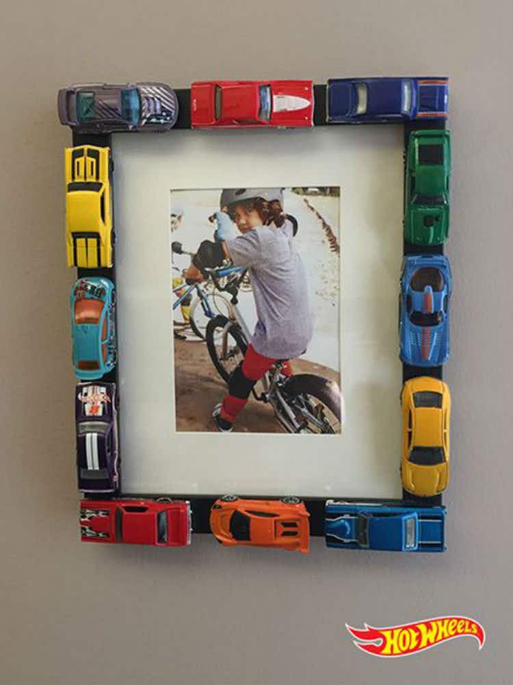 Line a picture frame with hot wheels.
