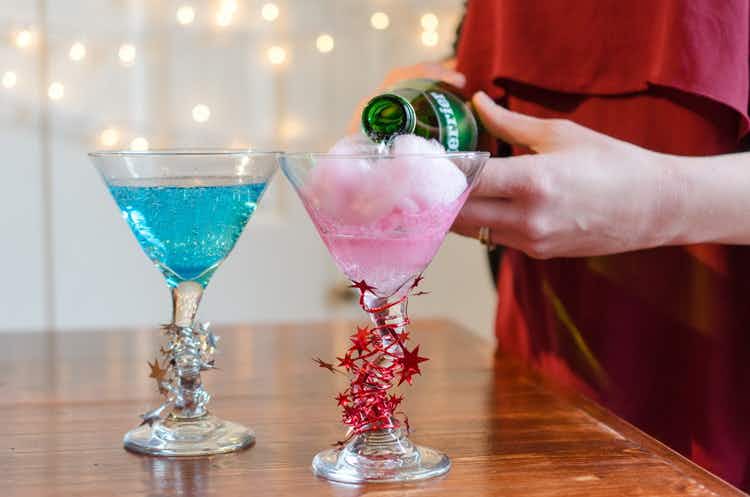 Pour champagne or sparkling water over cotton candy for colorful, fizzy drinks.