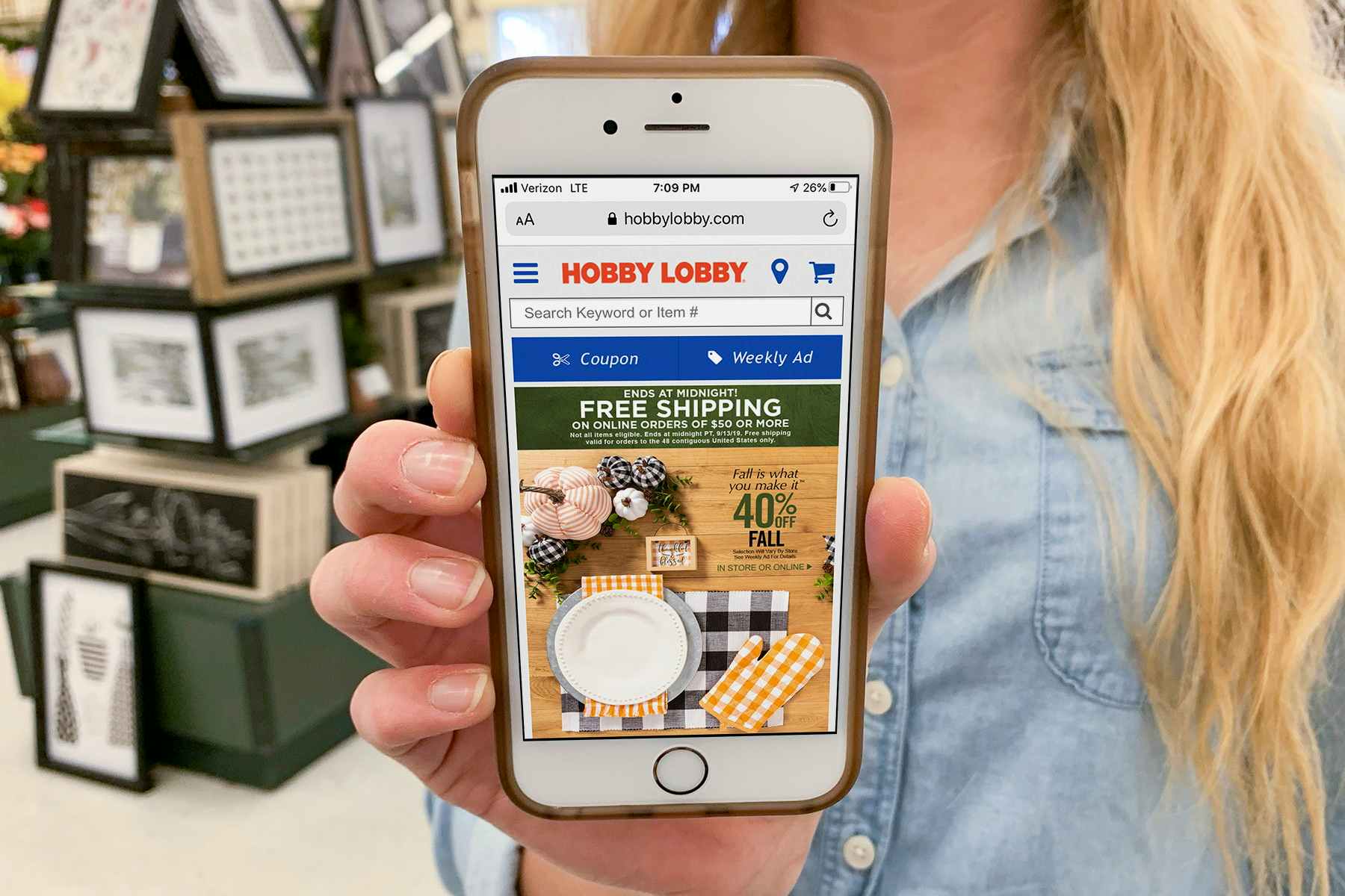 A cell phone screen showing Hobby Lobby's home page featuring a free shipping offer.