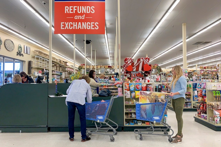 People in line at the Refunds and Exchanges checkout register.