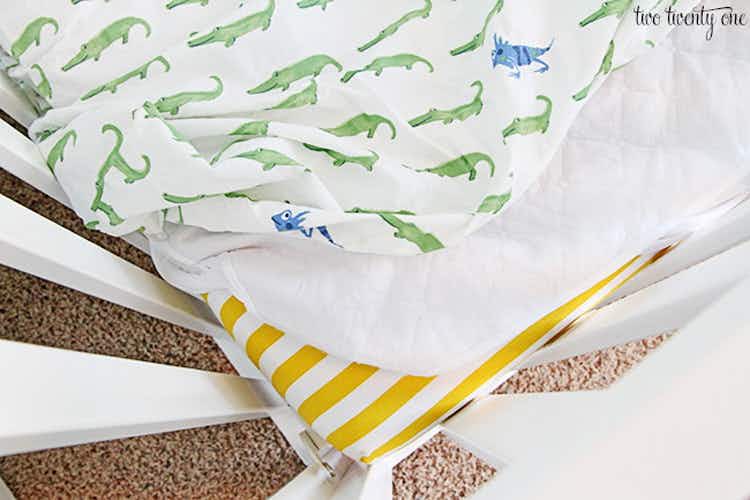 Make middle-of-the-night diaper blowouts easier by adding a double layer of bedding. 