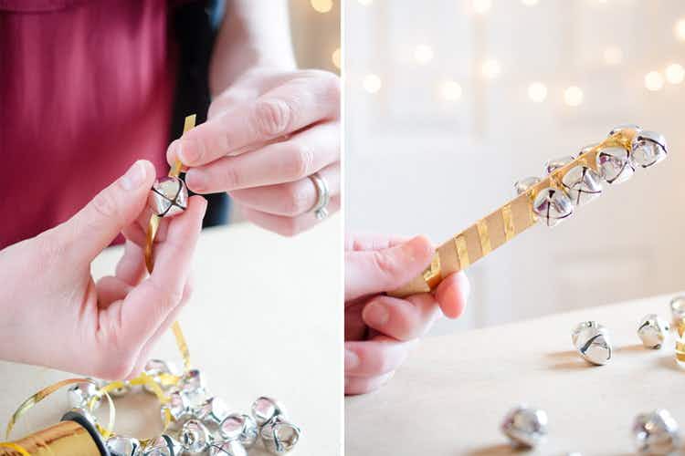 someone putting bells on a ribbon and wrapping it around a popsicle stick