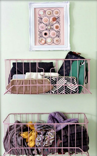 Hang wire baskets on the back of a door.