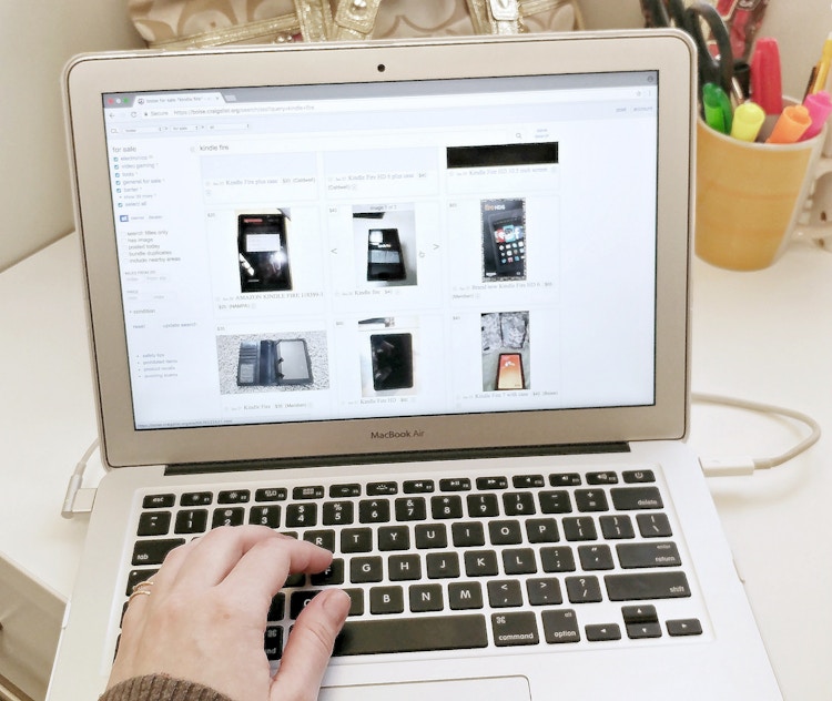 someone looking through Craigslist on a laptop
