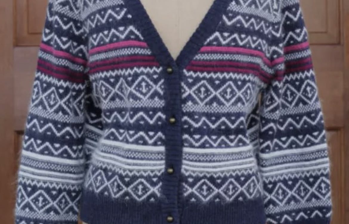 A knit sweater one a manikin