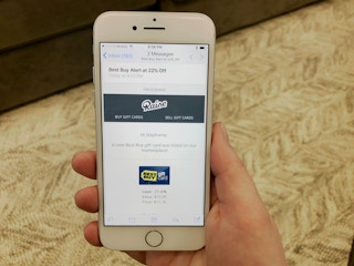 someone using their phone to look at raise.com 