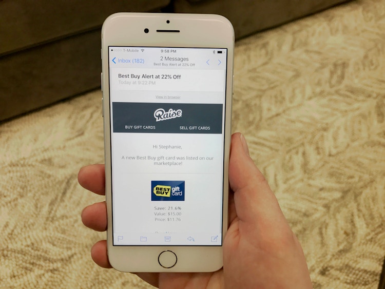 someone using their phone to look at raise.com 