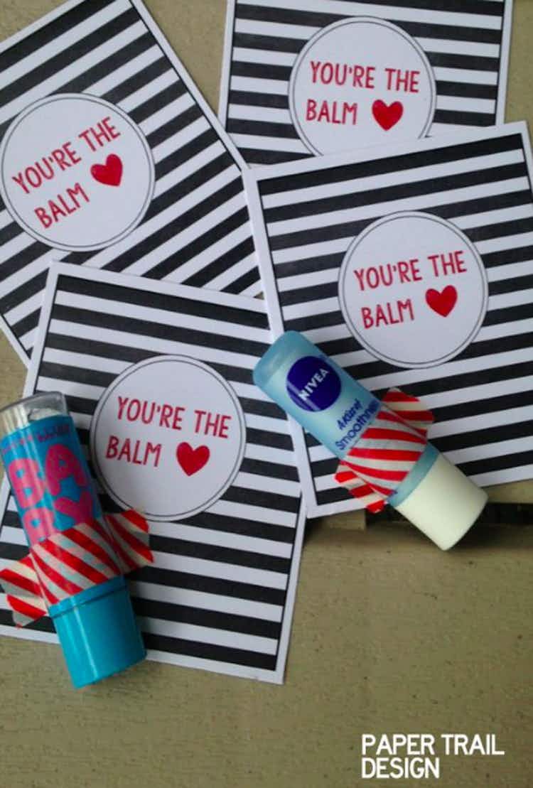 A valentine's day craft for kids that says "you're the balm" printed on DIY cards