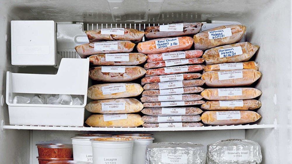 Lay freezer meals flat to save space.