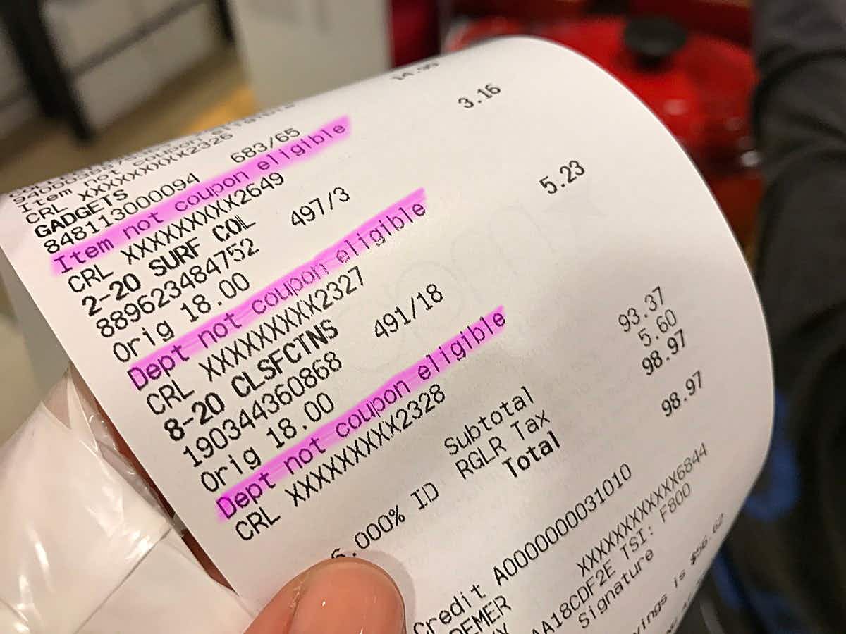 a macy's receipt showing certain departments are not eligible for coupons