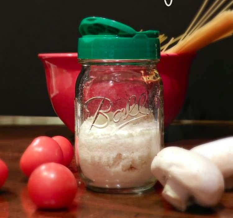 Screw on a parmesan cheese shaker lid.