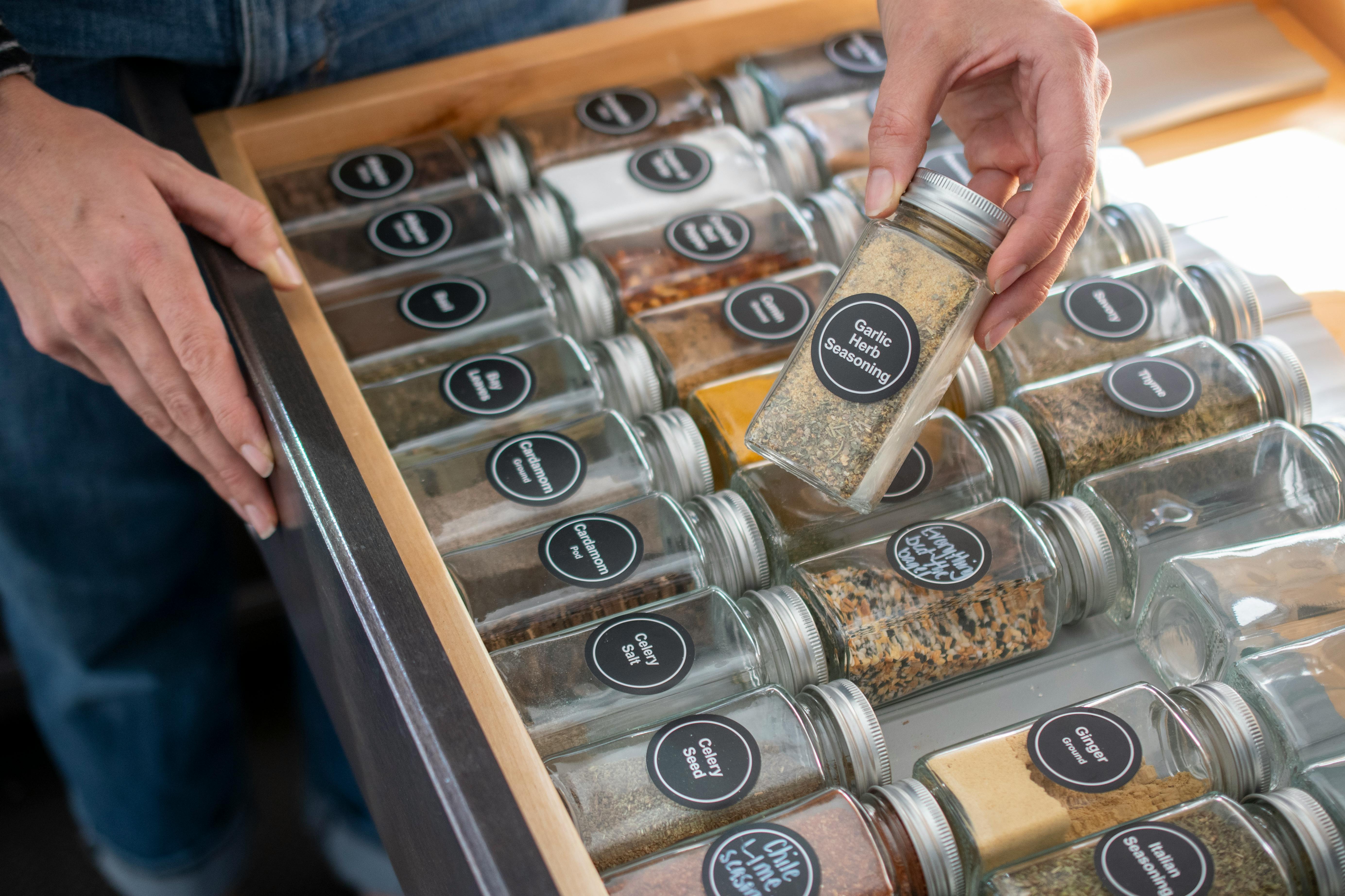 A drawer filled with spice jars
