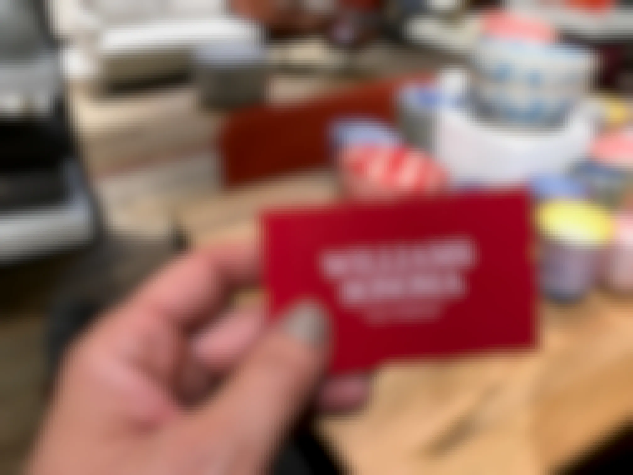 A person holding a Williams-Sonoma gift card in their hand.