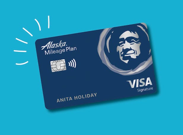 An Alaska Airlines visa card on a blue background.