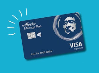 An Alaska Airlines visa card on a blue background.