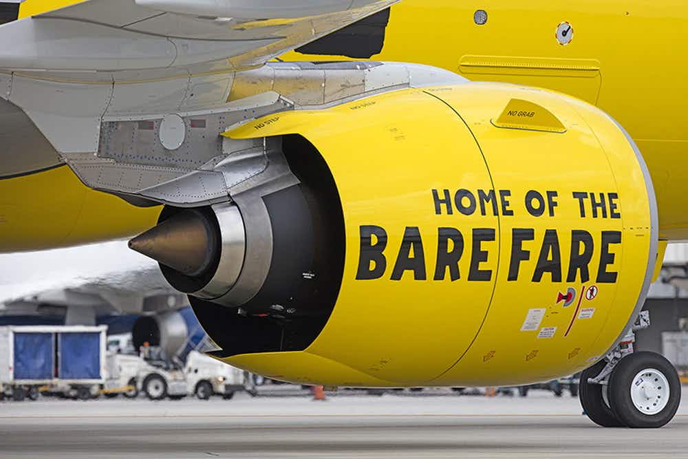 spirit airlines plane engine that says "home of the bare fare