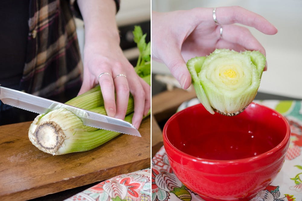 A person cutting off the end of celery next to a person placing a celery stump into a bowl of water.