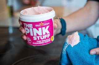 A glass cooktop stove being cleaned with Soft Scrub The Pink Stuff Cleaning Paste