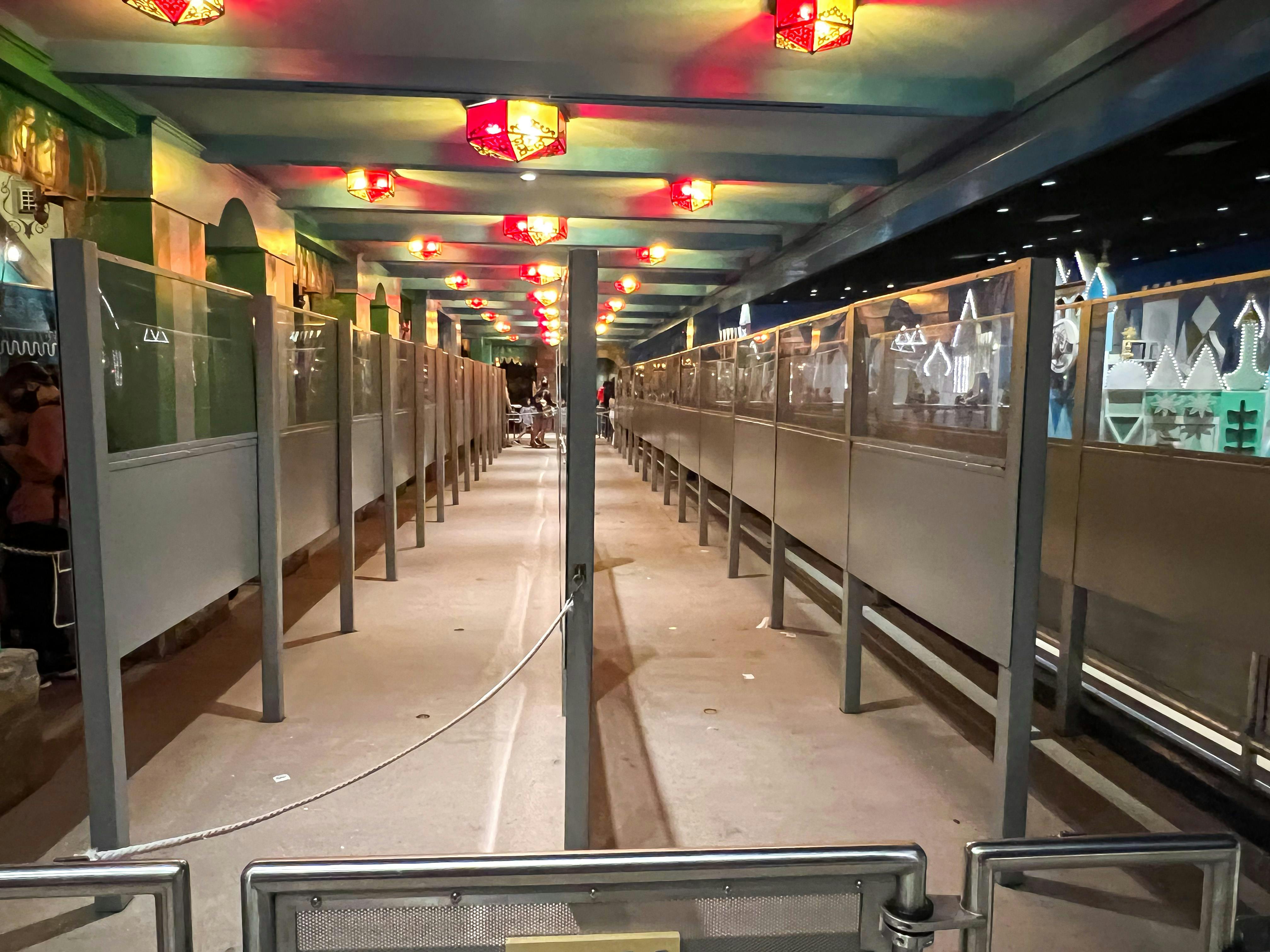 An empty area where people usually line up for a ride at Disney World.