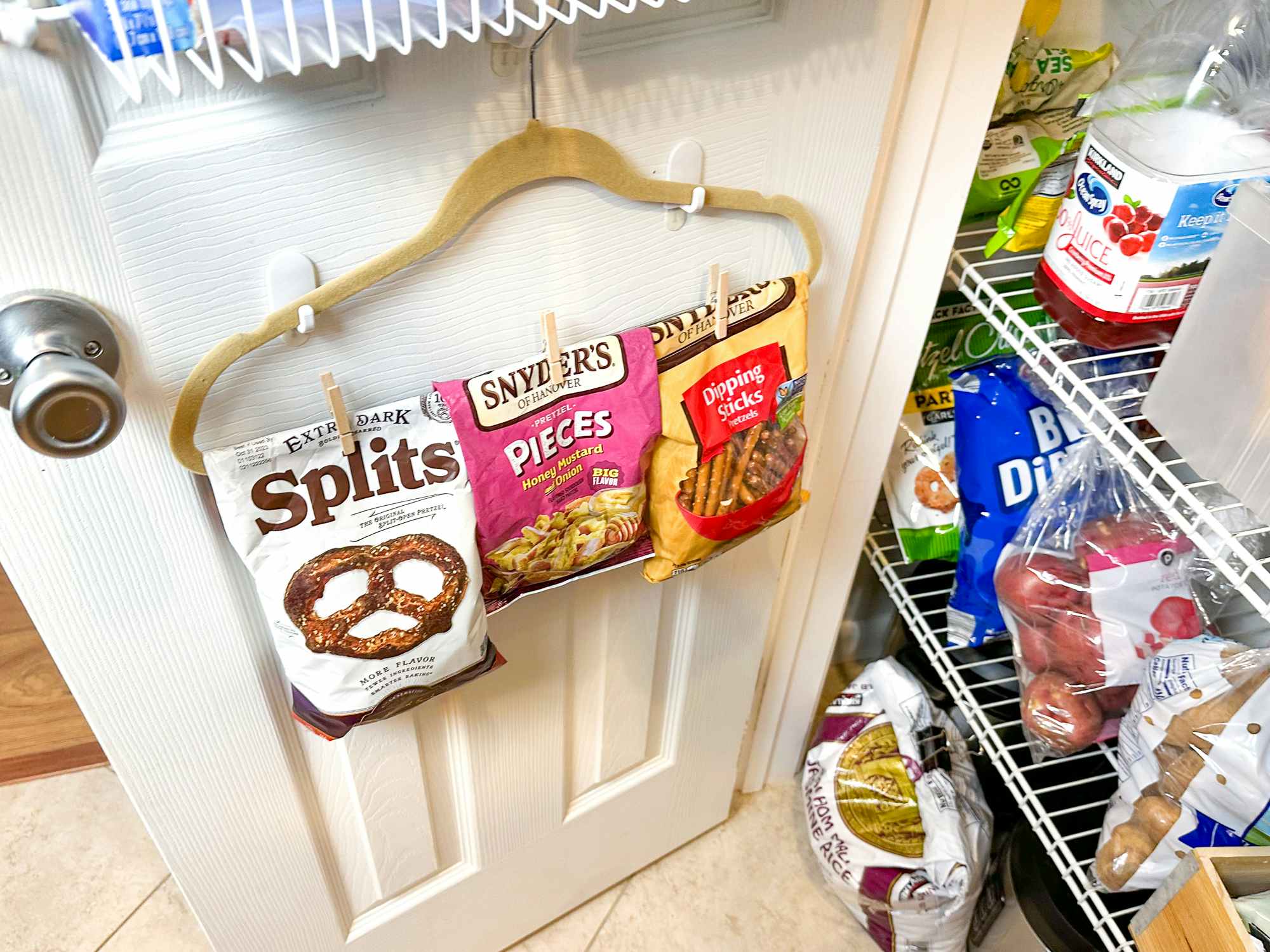 https://prod-cdn-thekrazycouponlady.imgix.net/wp-content/uploads/2017/02/how-to-organize-pantry-food-organization-open-chip-pretzel-bags-clip-to-hanger-inside-pantry-clothes-pins-1679417702-1679417702.jpg?auto=format&fit=fill&q=25