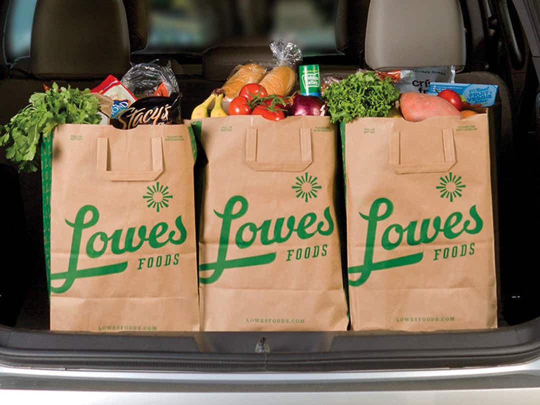 Bags of groceries from Lowe's Foods in a vehicle trunk