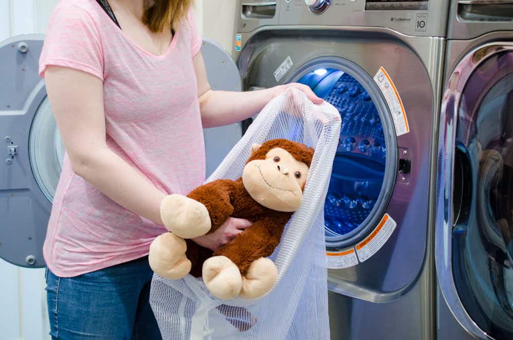 Wash one stuffed animal at a time in a mesh laundry bag.