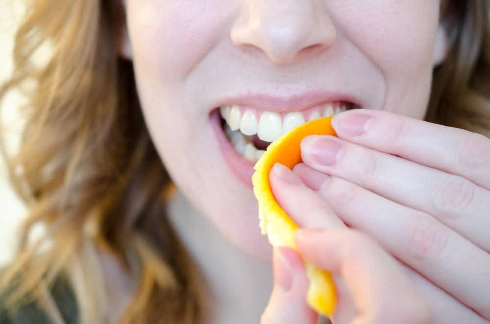 Use the white side of an orange peel to gently whiten teeth.