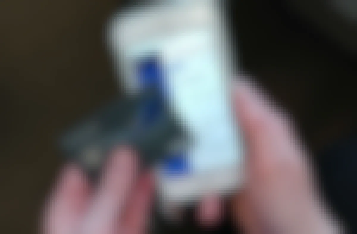 someone holding southwest credit card next to phone