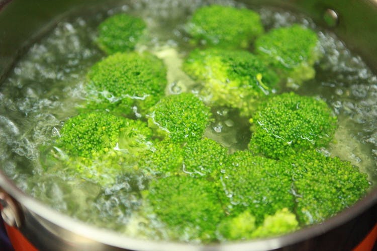 brocolli in pot of boiling water