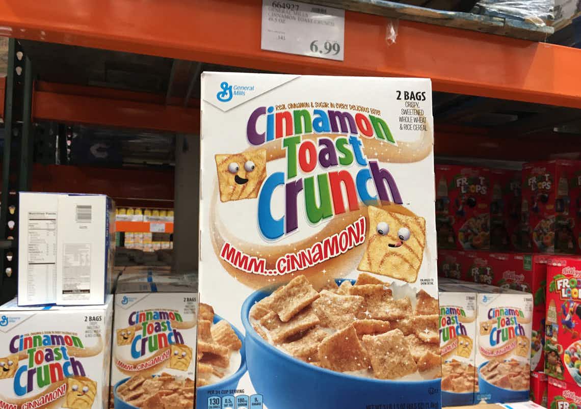 cereal being held up inside costco in front of shelf 