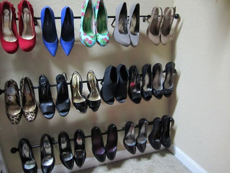 Hang heels on curtain rods.