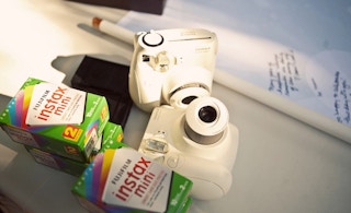 Make your own photo booth with an instant film camera.