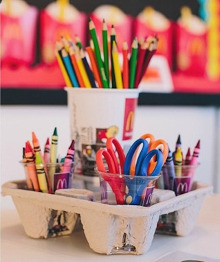 Store craft supplies in a fast-food drink holder.