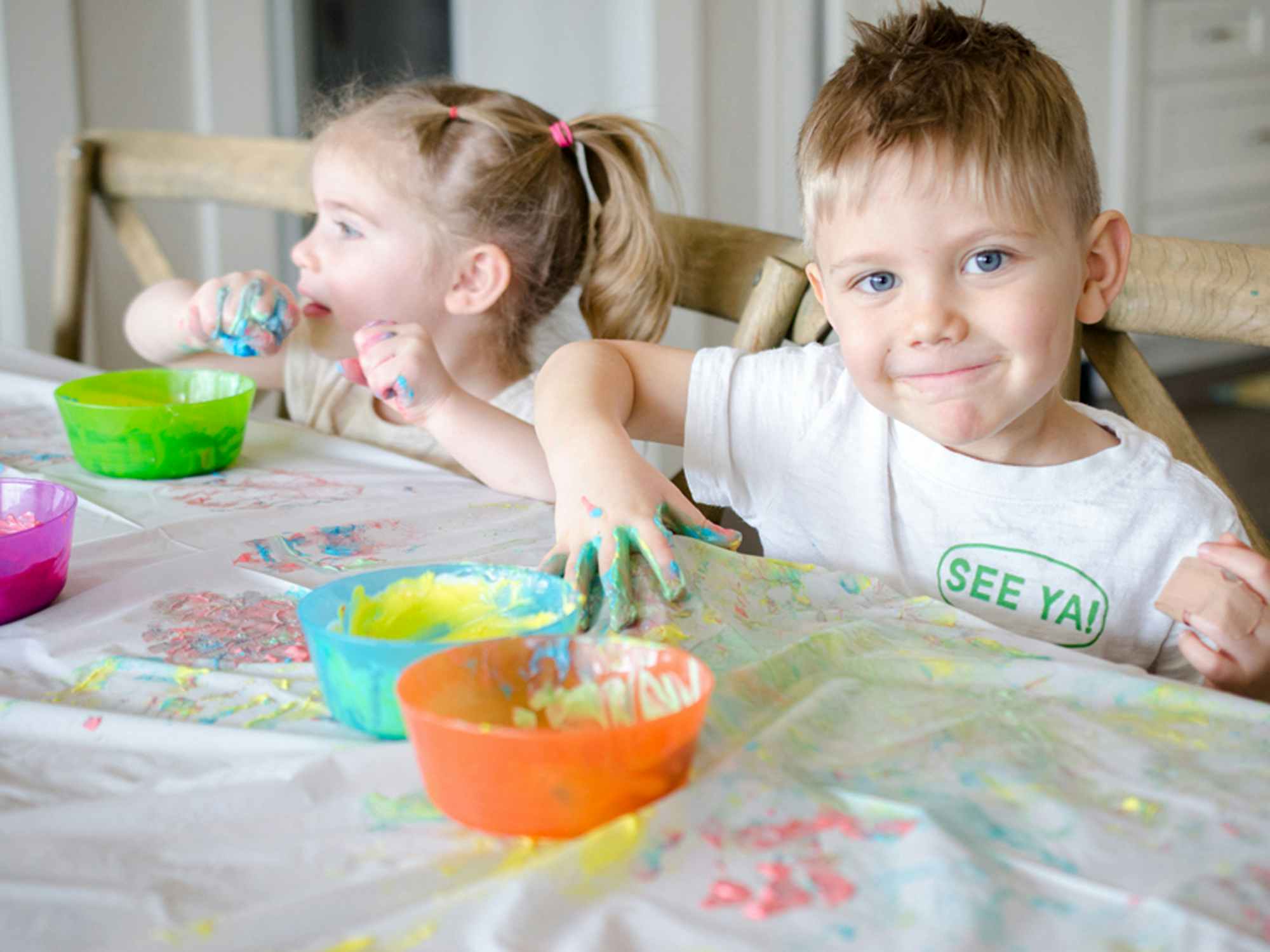 children playing with finger paints