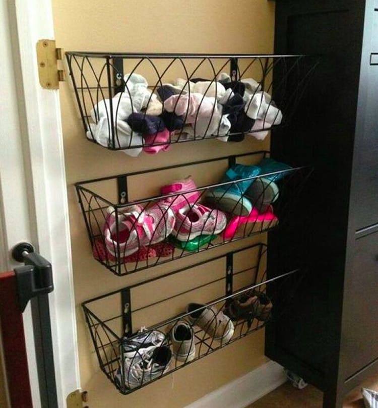 Hang flower boxes for kids' shoes.