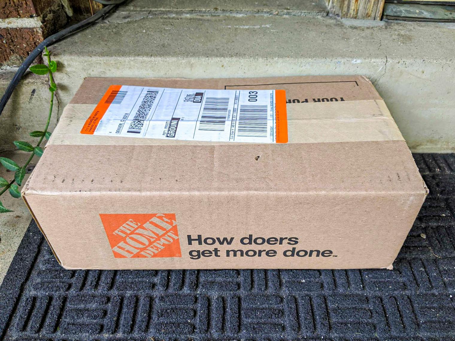 Home Depot box on a doorstep