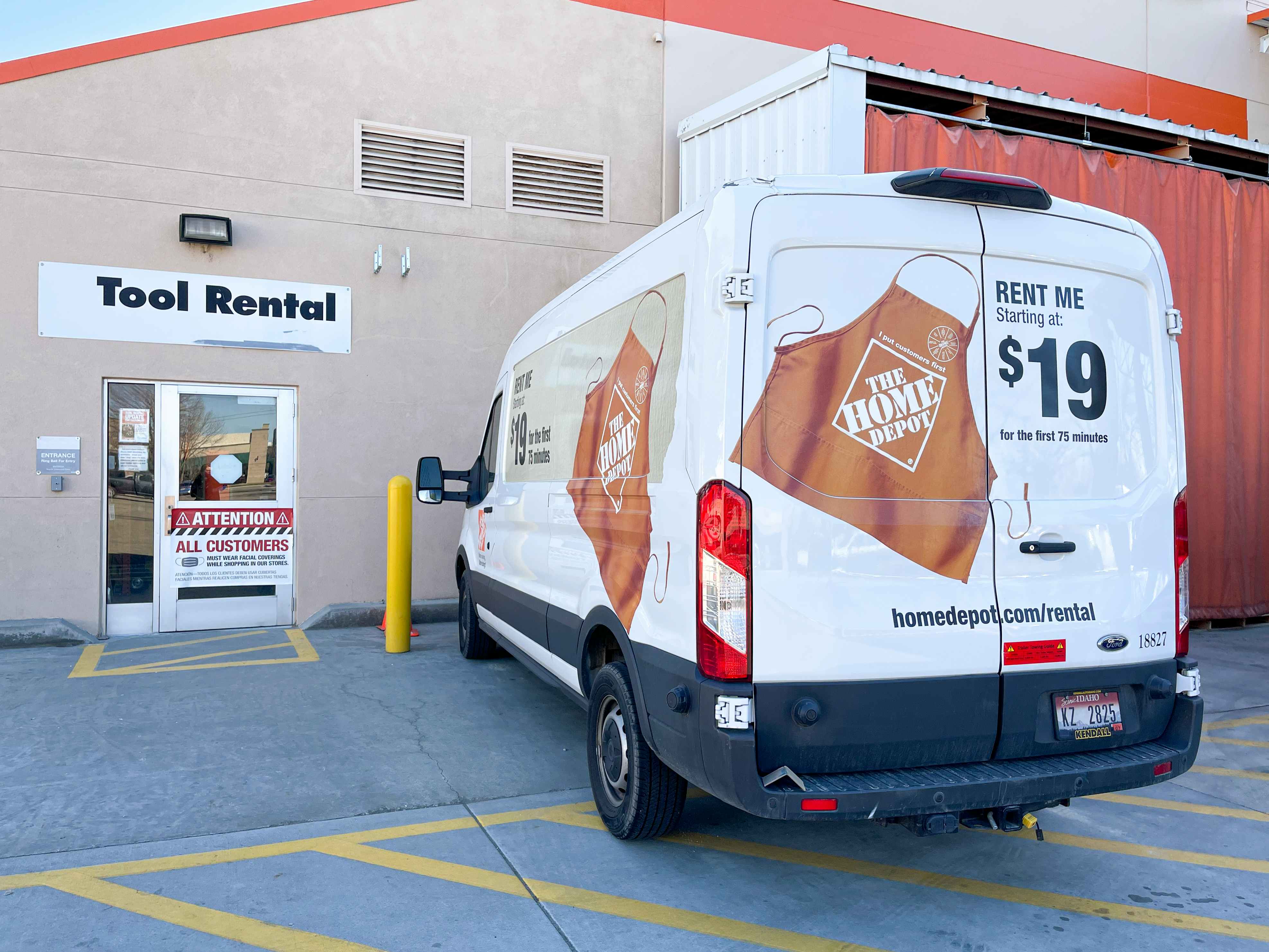 A Rent Me van parked in front of The Home Depot tool rental entrance