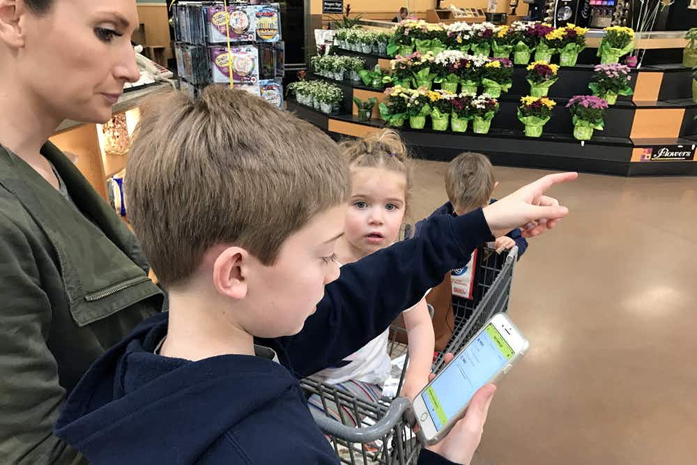 Woman and kids in a grocery store.