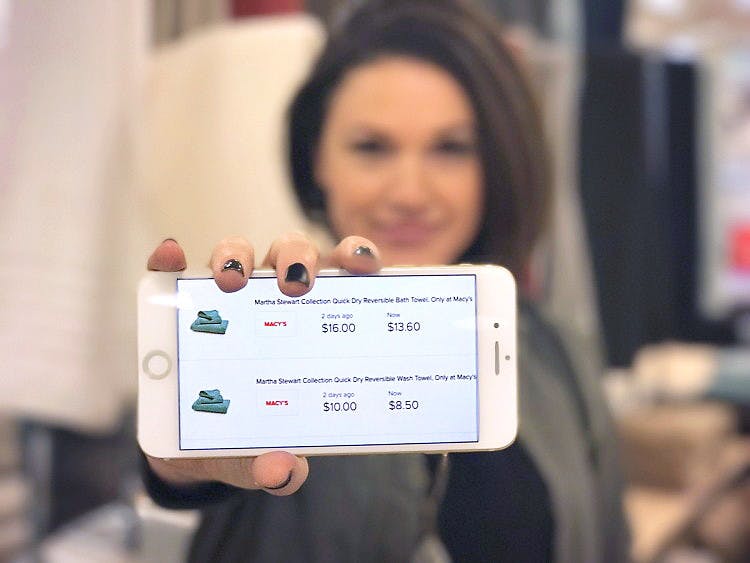 cellphone being held out with Paribus app