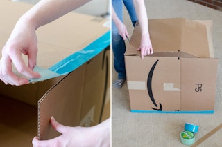 A person taping up cardboard boxes.
