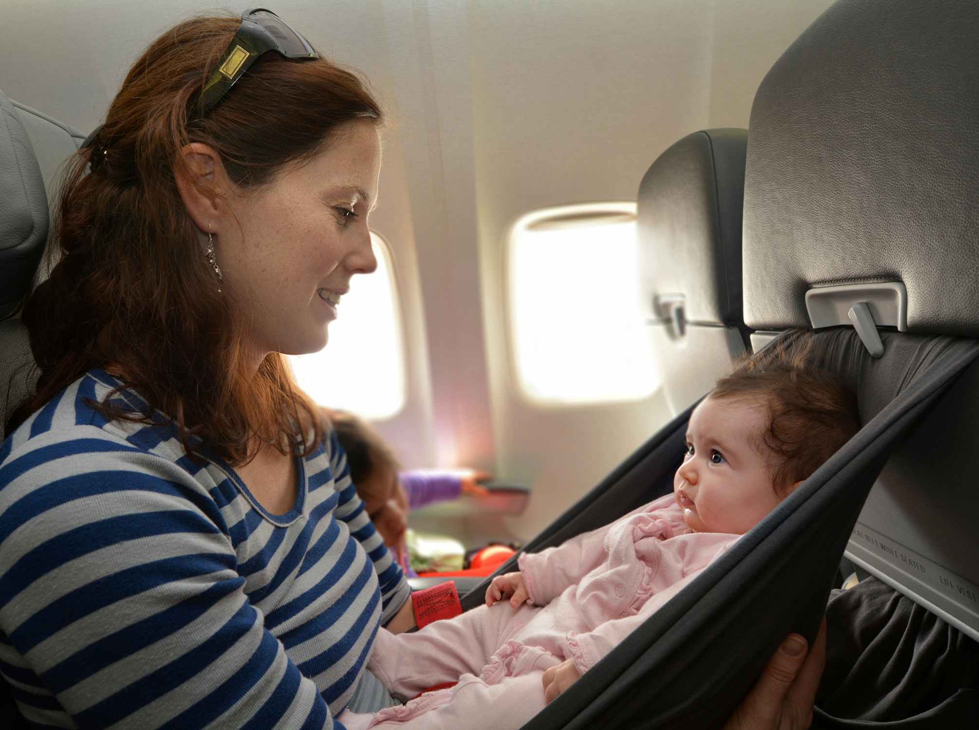 mother and baby on airplane
