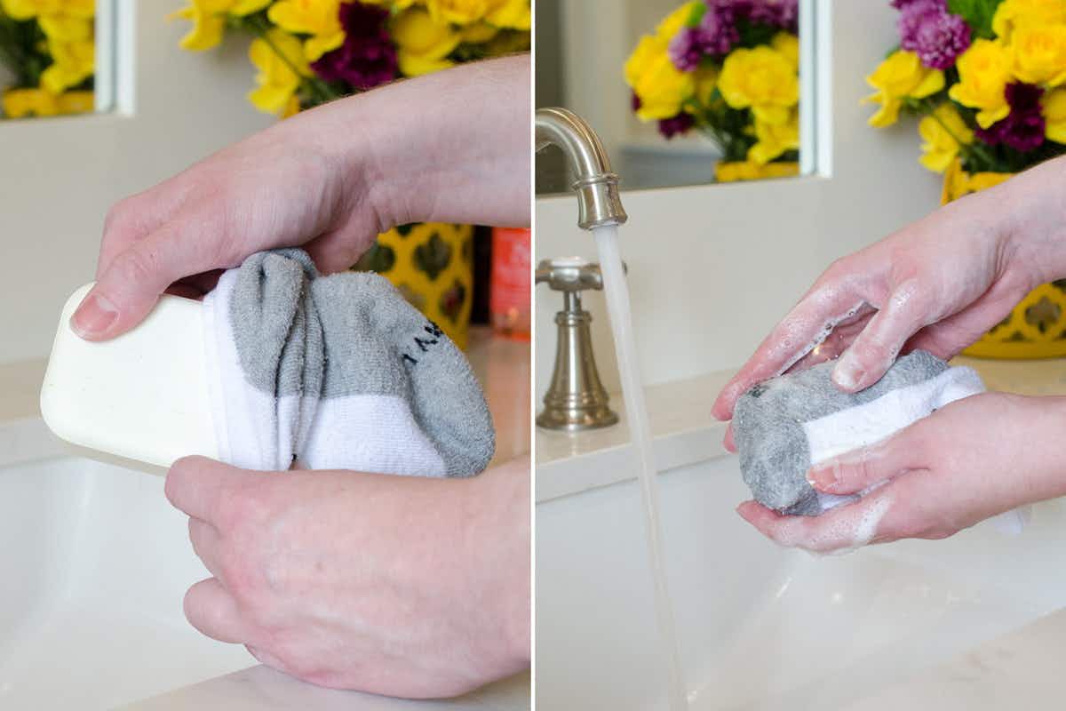 A person putting a bar of soap into a sock.