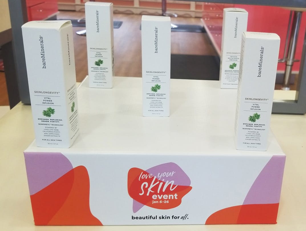 bareMineral products on a stand that reads, love your skin event