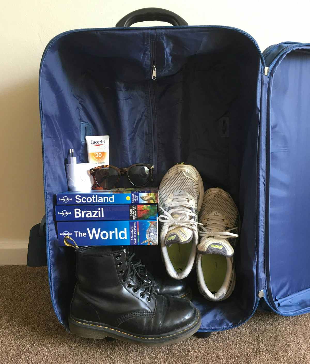 Pack the heaviest items in the bottom of a suitcase for easier rolling and less clothing wrinkles.