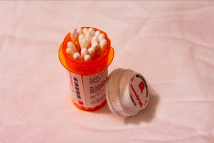 Store Q-tips in an old pill container.