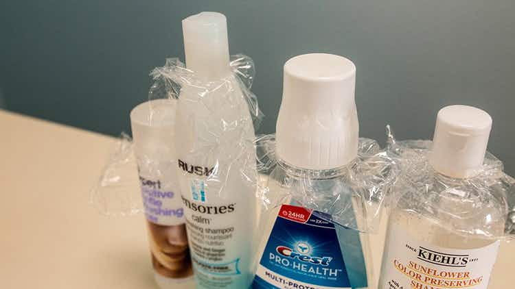Stop toiletry bottles from leaking with plastic wrap.