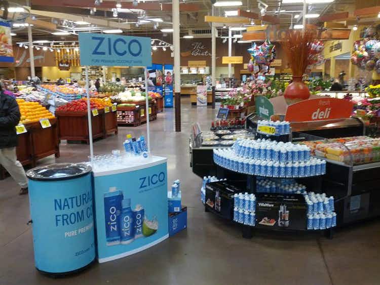 A sample station in a grocery store for Zico coconut water.