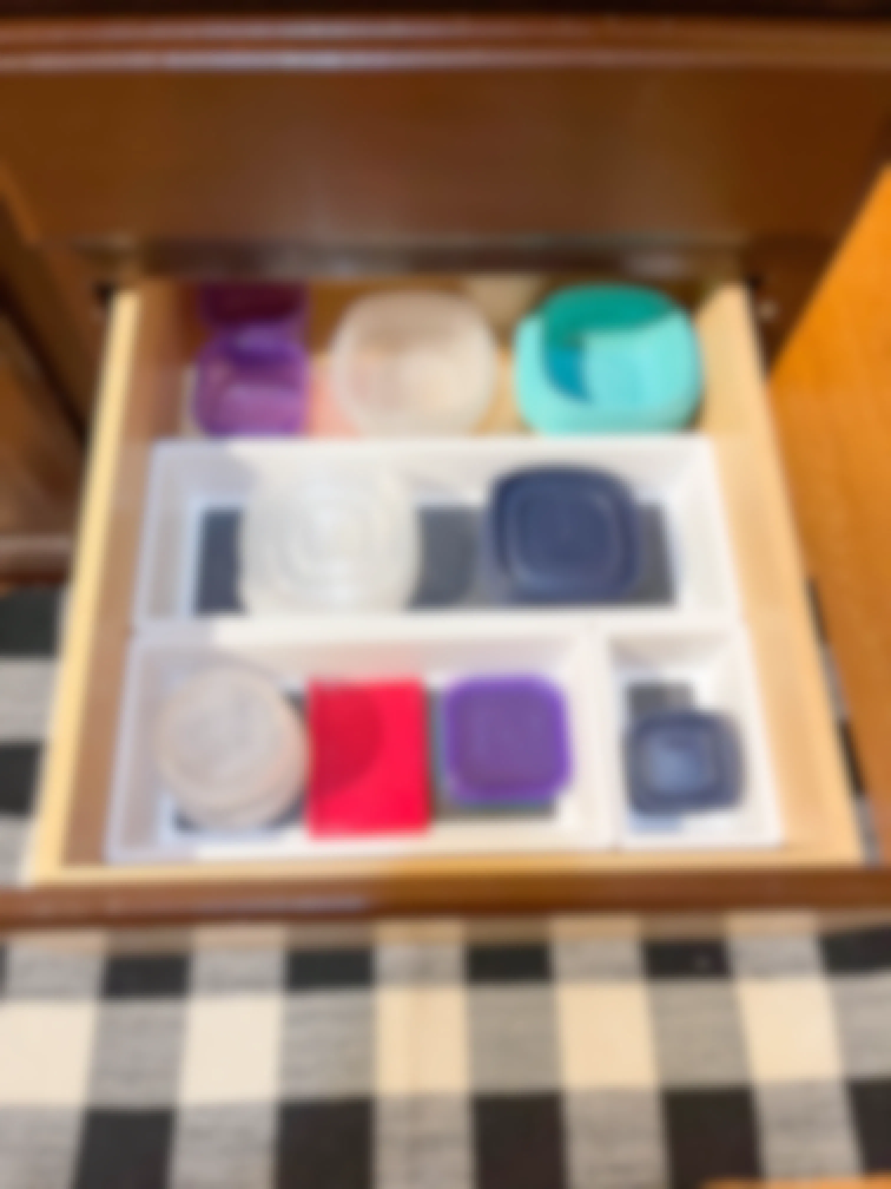 tupperware organized in drawer